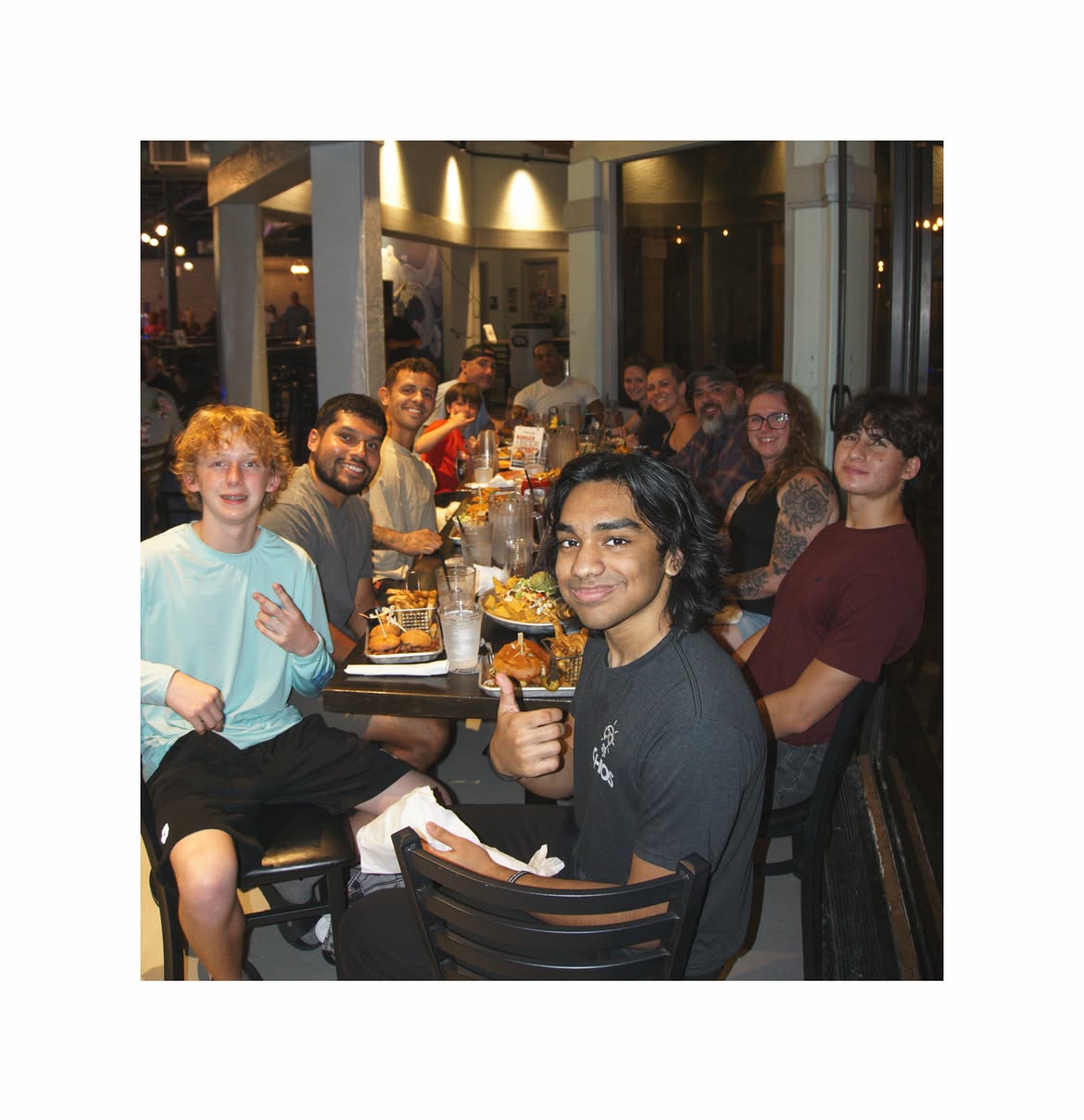 Traktion Jiu Jitsu members sharing burger night together after class