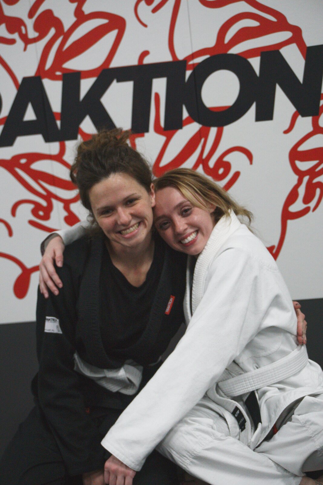 Adults drilling technique together in class at Traktion Jiu Jitsu