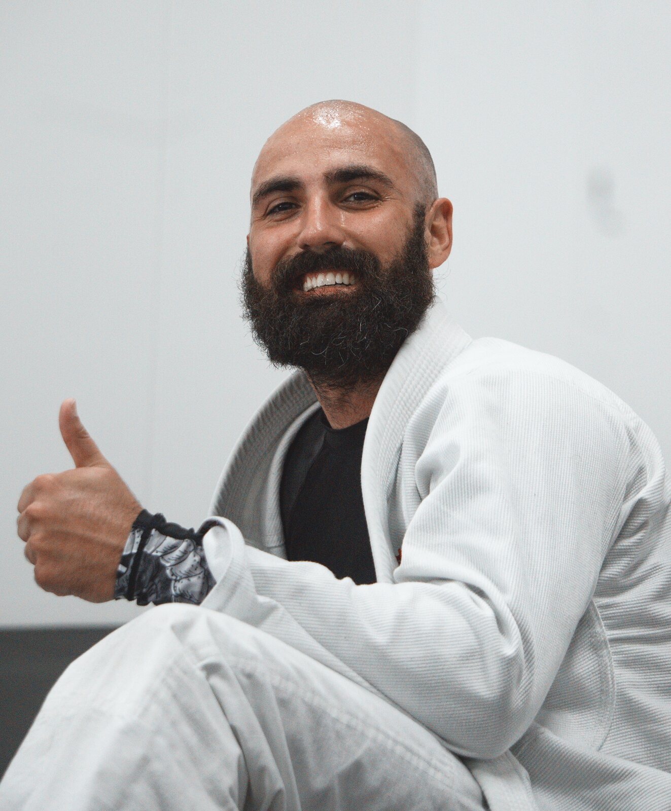 Adult students training Brazilian Jiu Jitsu on the mat at Traktion