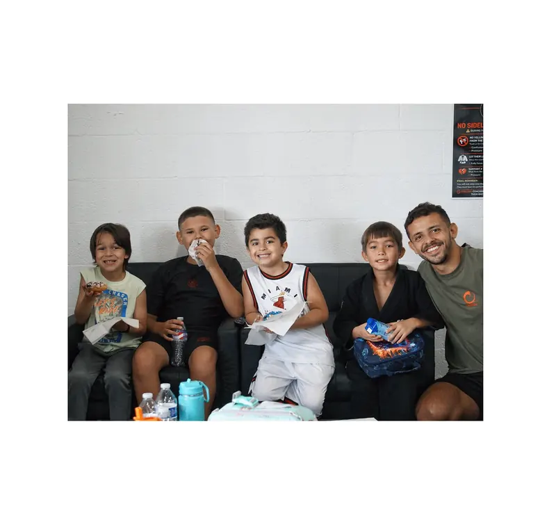 Traktion members hanging out together at the academy after training